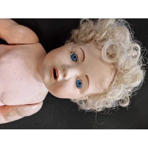 106 - A vintage German porcelain crying doll, has had a replacement head from Germany.  Tip her and she cr... 