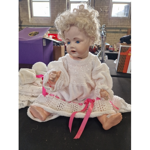 106 - A vintage German porcelain crying doll, has had a replacement head from Germany.  Tip her and she cr... 