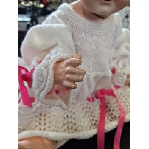 106 - A vintage German porcelain crying doll, has had a replacement head from Germany.  Tip her and she cr... 