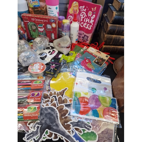 143 - A bundle of children's activity toys including elf on the shelf, colouring, bubbles and much more