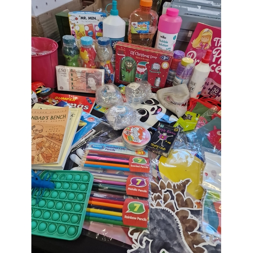 143 - A bundle of children's activity toys including elf on the shelf, colouring, bubbles and much more