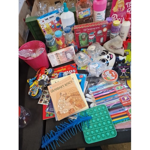 143 - A bundle of children's activity toys including elf on the shelf, colouring, bubbles and much more