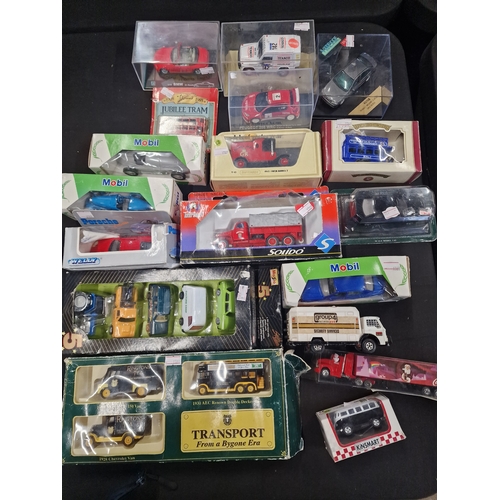 11 - A collection of vintage cars and vans including match box, Ringtons, Welly and Die-Cast