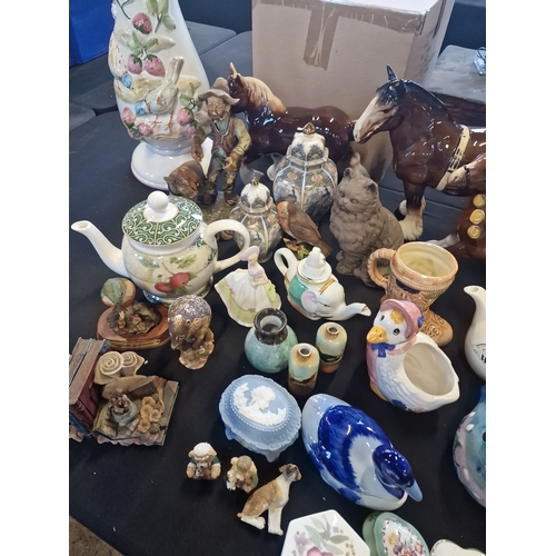 116 - A large collection of pottery and ornaments. Including wedgewood, coalport and Arthur Wood,