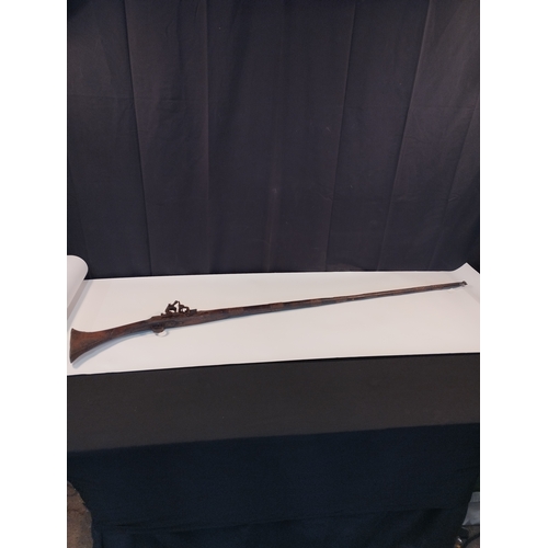 23 - Antique Short Stock Camel Black Powder Flint Lock Rifle  Decommissioned. Approx 158cm Length.