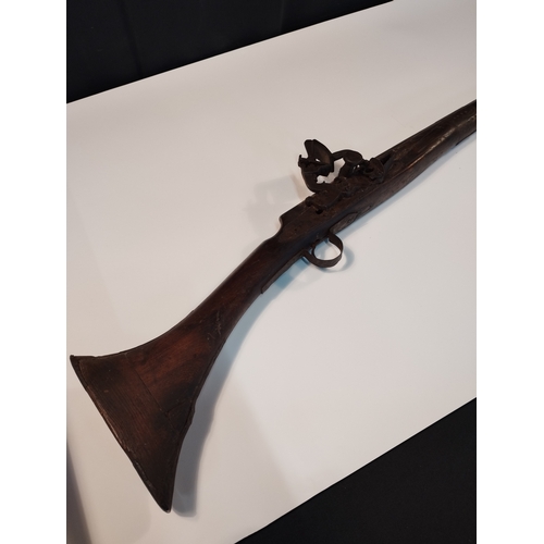 23 - Antique Short Stock Camel Black Powder Flint Lock Rifle  Decommissioned. Approx 158cm Length.