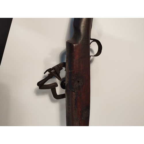 23 - Antique Short Stock Camel Black Powder Flint Lock Rifle  Decommissioned. Approx 158cm Length.