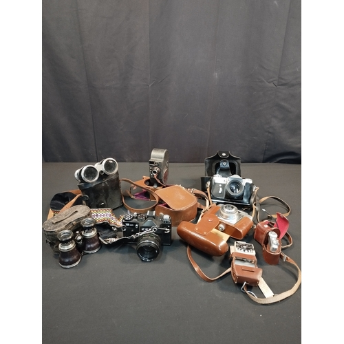 32 - Selection of Vintage Binoculars and Cameras. Inc Agfa and Zenit Cameras and Bell & Howell Filmo Spor... 