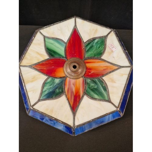 41 - A Tiffany style Lamp shade. Octangal shape Cream, red, blue and green.  33cm at the widest point