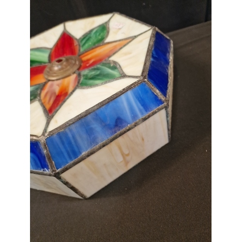 41 - A Tiffany style Lamp shade. Octangal shape Cream, red, blue and green.  33cm at the widest point