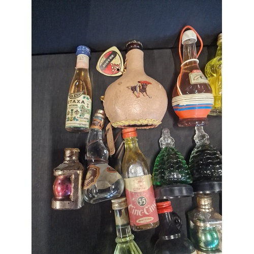 42 - A quantity of 16 alcohol miniatures includes Brandy, Metaxa a d Tequlia