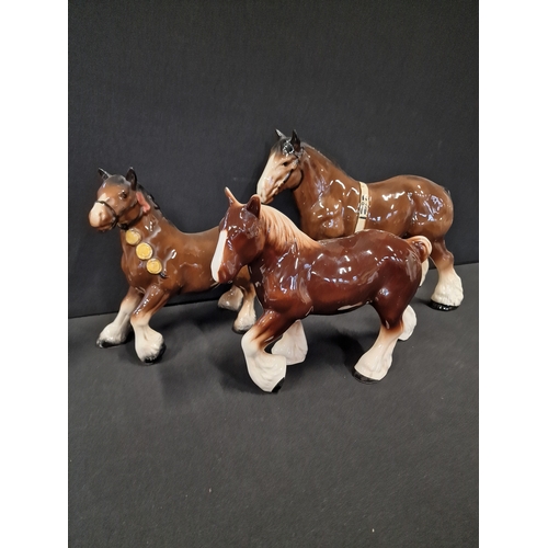 49 - Three Beswick style hand painted Shire horses