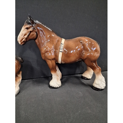 49 - Three Beswick style hand painted Shire horses