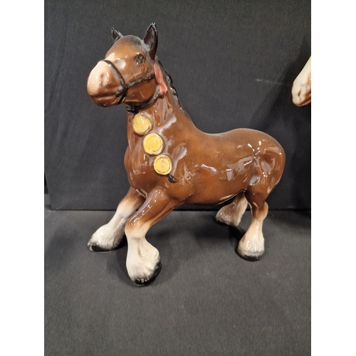 49 - Three Beswick style hand painted Shire horses