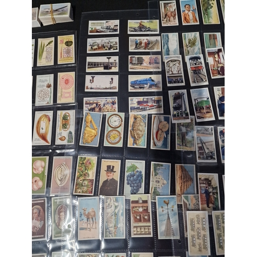 50 - A large Bundle of cigarette cards, includes sets in original packaging and frames.