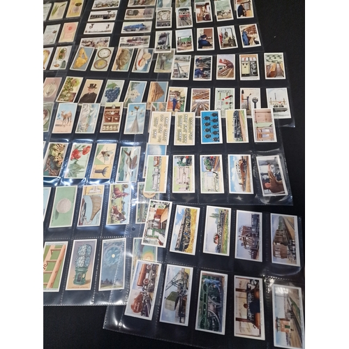 50 - A large Bundle of cigarette cards, includes sets in original packaging and frames.