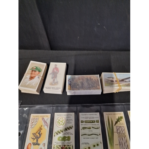 50 - A large Bundle of cigarette cards, includes sets in original packaging and frames.