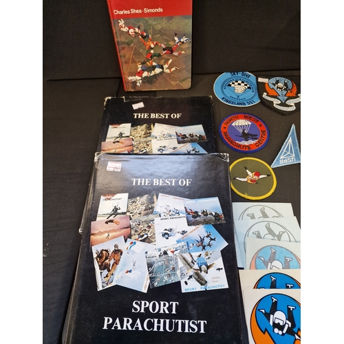 79 - A bundle of Parachutist, patches and books