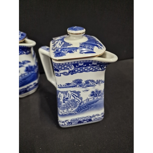 107 - Four vintage Ringtons tea pots.  Three oriental willow tree design and one floral pattern