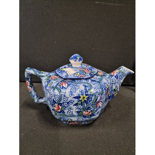 107 - Four vintage Ringtons tea pots.  Three oriental willow tree design and one floral pattern