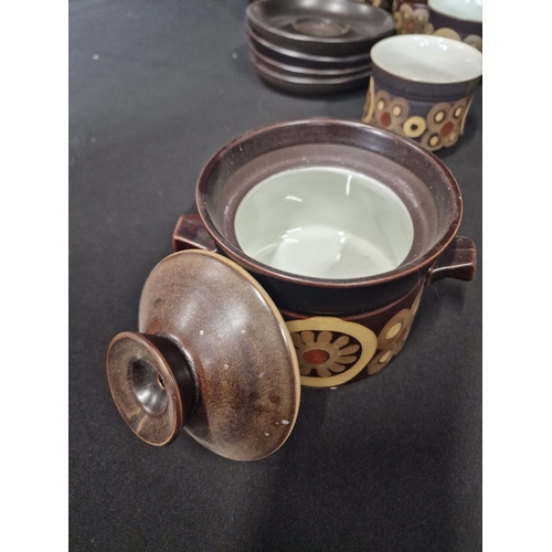 127 - A collection of Denby in Arabesque design.  Includes, sugar bowl, milk jug, three cups, four saucers... 