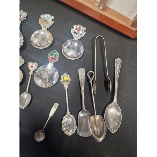 156 - A collection of tea spoons and display case