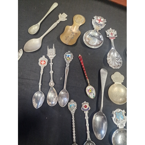 156 - A collection of tea spoons and display case