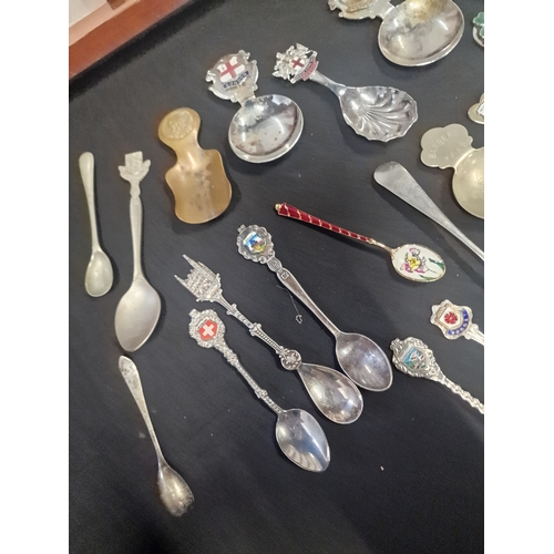 156 - A collection of tea spoons and display case