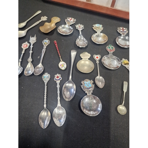 156 - A collection of tea spoons and display case