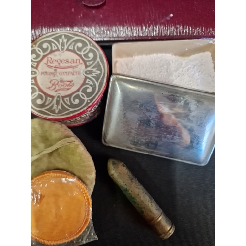 189 - A victorian ladies cosmetic set with case.  Contents include, loose powder, rouge, mirror, lip stick... 