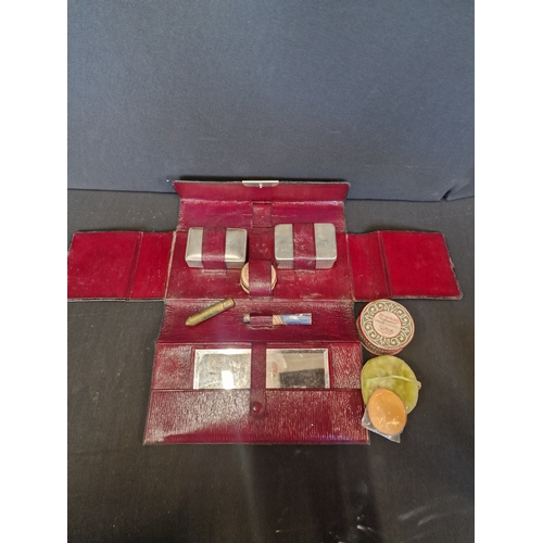 189 - A victorian ladies cosmetic set with case.  Contents include, loose powder, rouge, mirror, lip stick... 