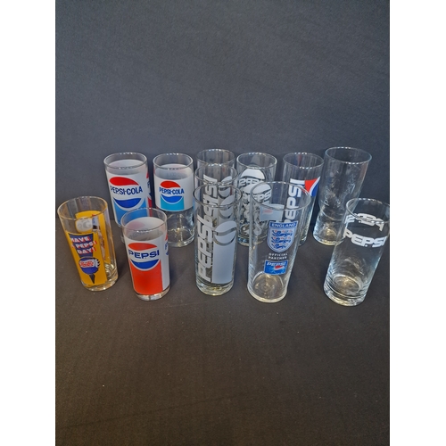 217 - A large collection of vintage PEPSI glass.  10 Different designs. 12 glasses in total.