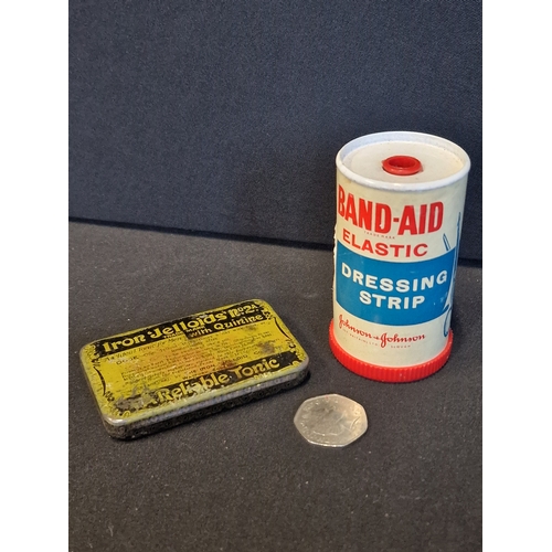 227 - Two vintage medical items.  BAND-Aid dressing strip by Johnson & Johnson and a tin for Iron Jelloids... 