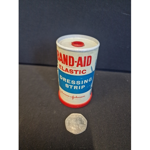 227 - Two vintage medical items.  BAND-Aid dressing strip by Johnson & Johnson and a tin for Iron Jelloids... 