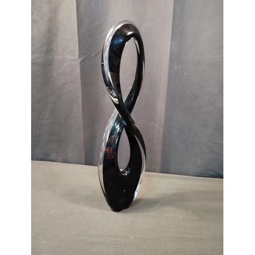 252 - Black and Clear Glass Figure of Eight Sculpture. Approx. 43cm Tall.