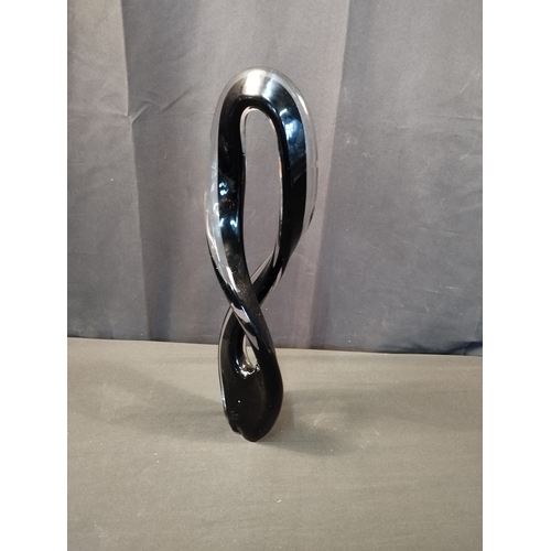 252 - Black and Clear Glass Figure of Eight Sculpture. Approx. 43cm Tall.