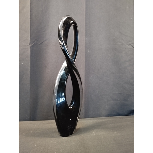 252 - Black and Clear Glass Figure of Eight Sculpture. Approx. 43cm Tall.