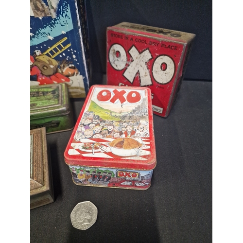 255 - A selection of vintage tins. Includes Elkes assorted biscuits, OXO and WD & HD Wills cigarettes