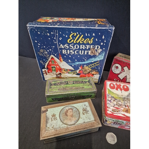 255 - A selection of vintage tins. Includes Elkes assorted biscuits, OXO and WD & HD Wills cigarettes