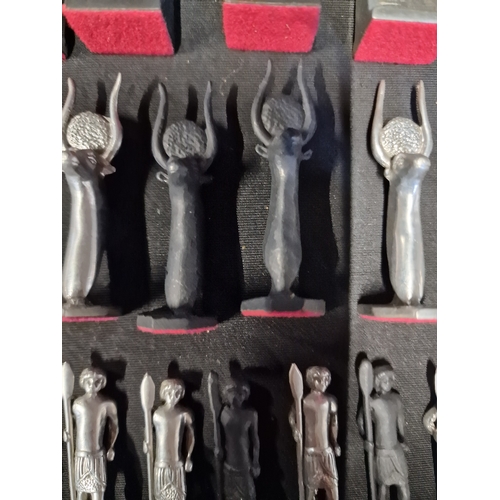 278 - A collection of Egyptian cast metal themed chess pieces