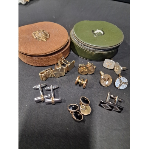 281 - A selection of vintage cuff links with two zipped storage cases