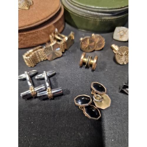 281 - A selection of vintage cuff links with two zipped storage cases