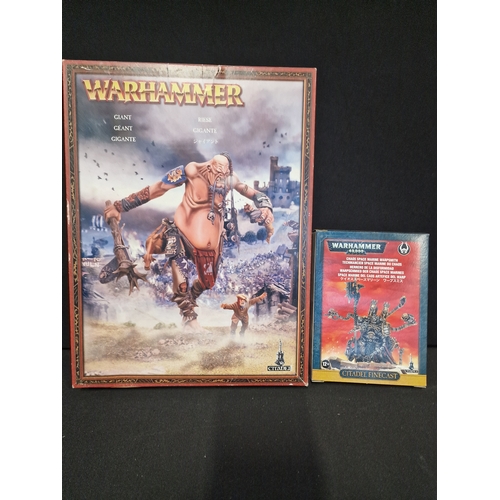 307 - Two warhammer 40,000 Citadel figures.  Giant and Choas space marine warpsmith