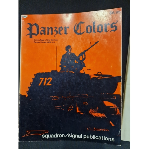 311 - Four model army tanks books.