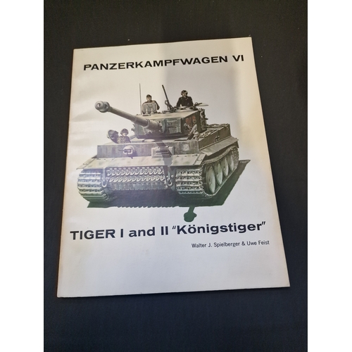 311 - Four model army tanks books.