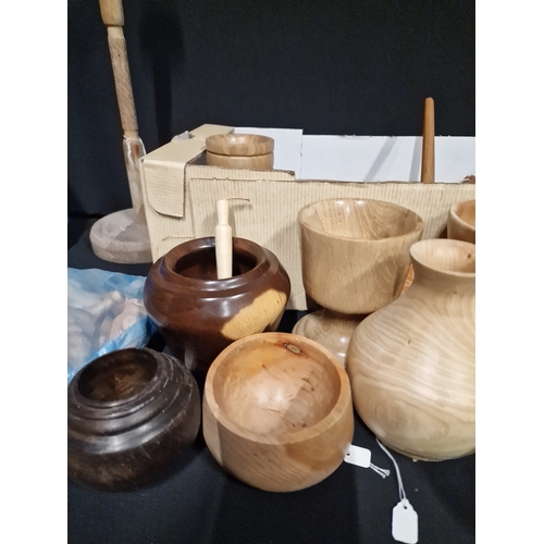 384 - A large selection of hand turned wooden items. Various woods, sizes and designs