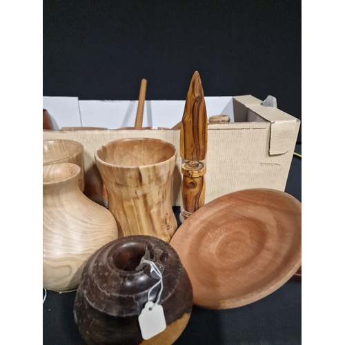 384 - A large selection of hand turned wooden items. Various woods, sizes and designs