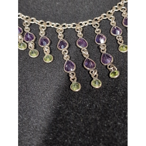 395 - Sterling silver and amethyst droplet necklace.