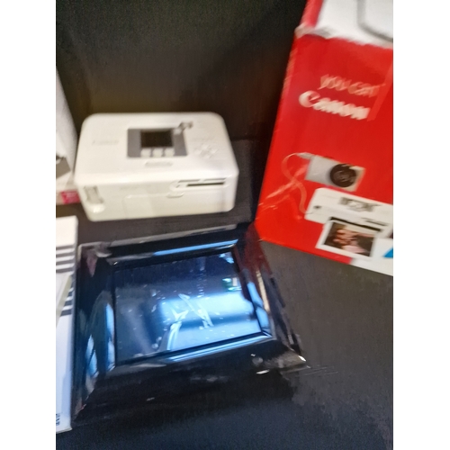 12 - A Canon direct printer kit.  With additional colour print paper and cartridges and 3 colour ink cass... 