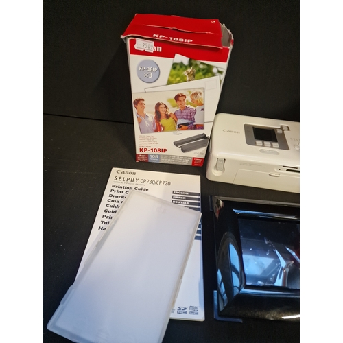 12 - A Canon direct printer kit.  With additional colour print paper and cartridges and 3 colour ink cass... 